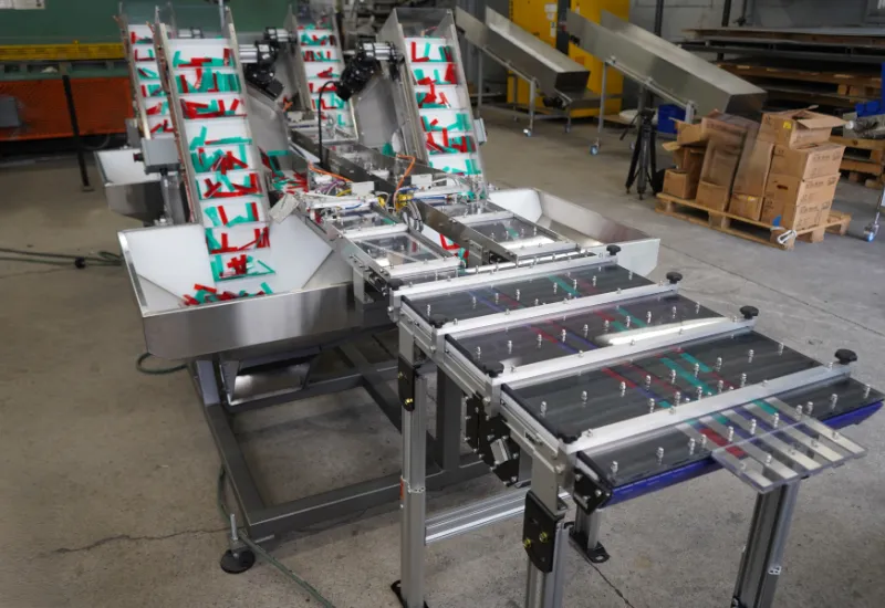 Multi-Lane Elevating Conveyor System for Reflector Sticks