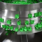 Vibratory Feeder Orients Spray Actuators at 265+ PPM